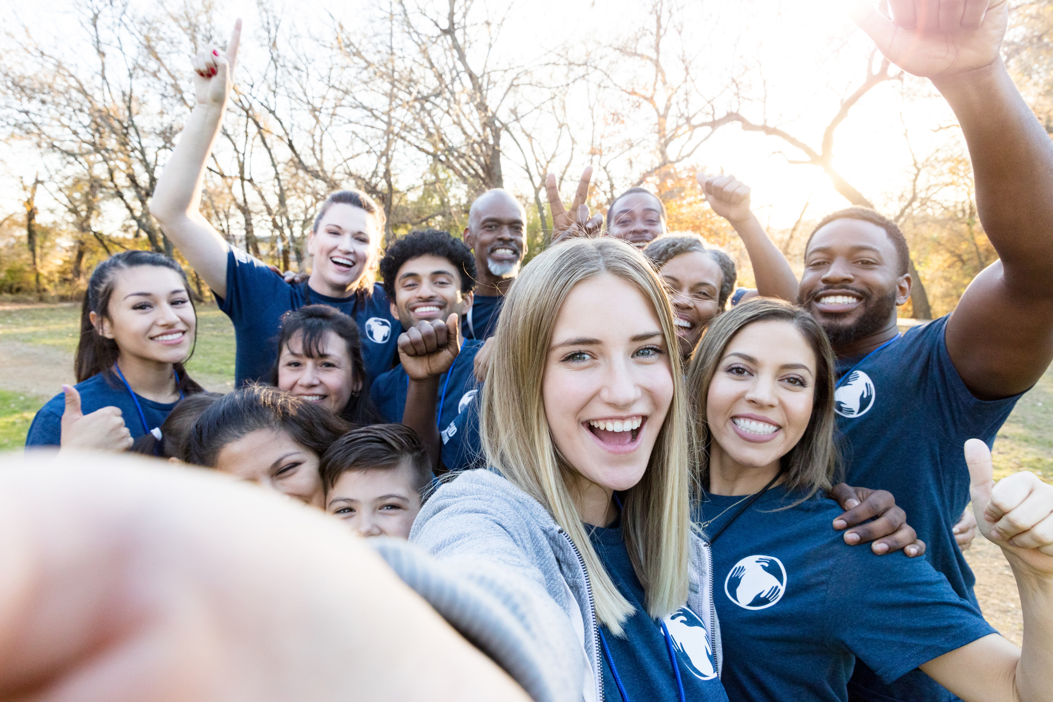 Group of volunteers take selfie during cleanup event